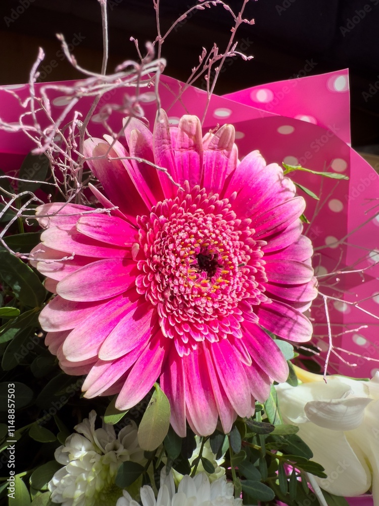 Pink round gerbera flowers in bouquet with decoration