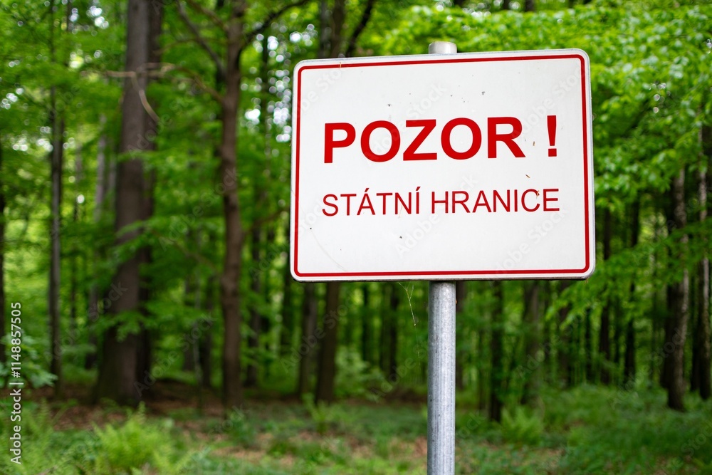 Warning sign BEWARE, NATIONAL BORDER written in Czech