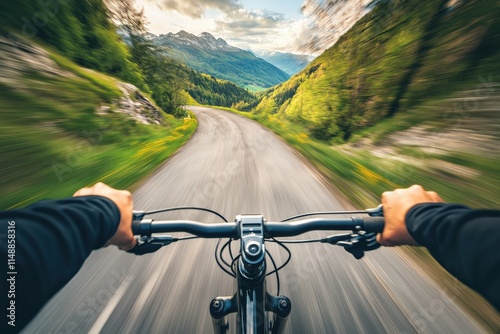 A cyclist riding on a scenic mountain road with a focus on kinetic energy generated by pedaling downhill photo