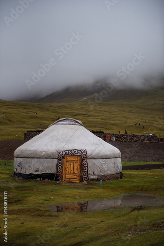 Mongolian local family live in the Ger between mountains and river, trees and lakes