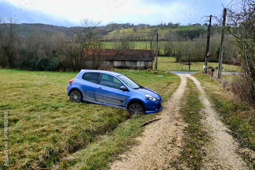 Car ending up in a drainage ditch after joy riders tried to take a short cut across a field at night
