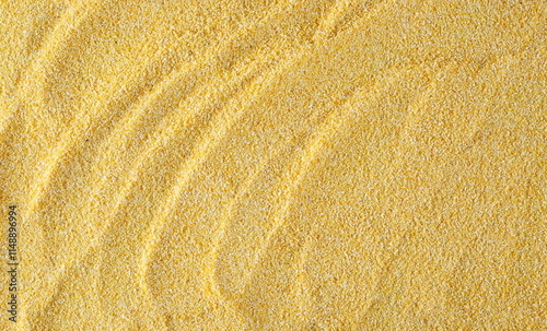 Corn polenta uncooked background and texture, top view 