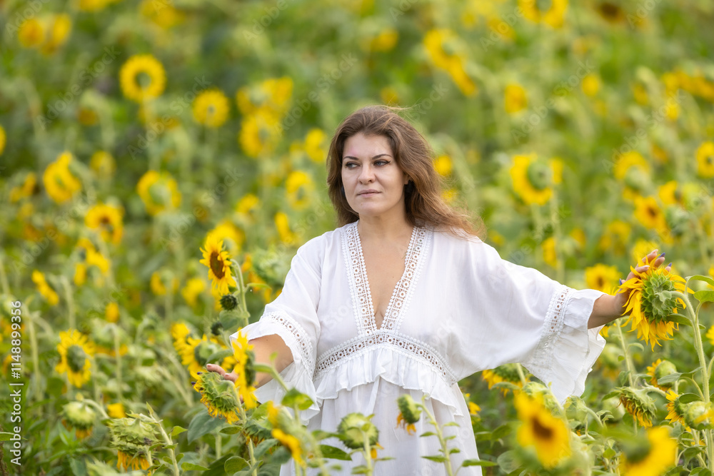 A Woman in White in a Field of Sunflowers: A Moment of Serenity Among Yellow Blossoms A Woman in White in a Field of Sunflowers: A Moment of Serenity Among Yellow Blossoms