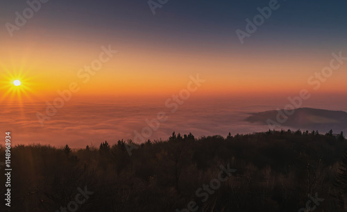 sunrise on the top of Ślęża Mountain, Sudetes, Lower Silesia, Poland.