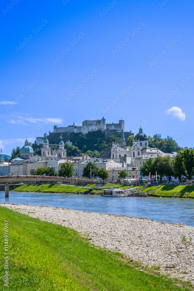 Fototapeta premium The City of Salzburg with Salzach River and Fortress Hochensalzburg in the State of Salzburg in Austria.