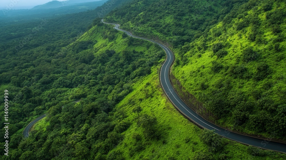 Scenic Curved Road Through Lush Green Hills and Forested Landscape Scenic Curved Road Through Lush Green Hills and Forested Landscape