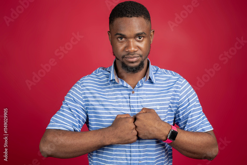 Portrait of a happy African American man over red background