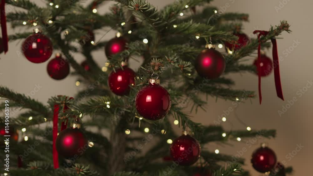 Happy New Year Christmas tree decorates with red glass ball on branch on background bokeh of side flickering light bulbs garlands for family winter holiday. Festival mood. Noel. Happy New Year Christmas tree decorates with red glass ball on branch on background bokeh of side flickering light bulbs garlands for family winter holiday. Festival mood. Noel.