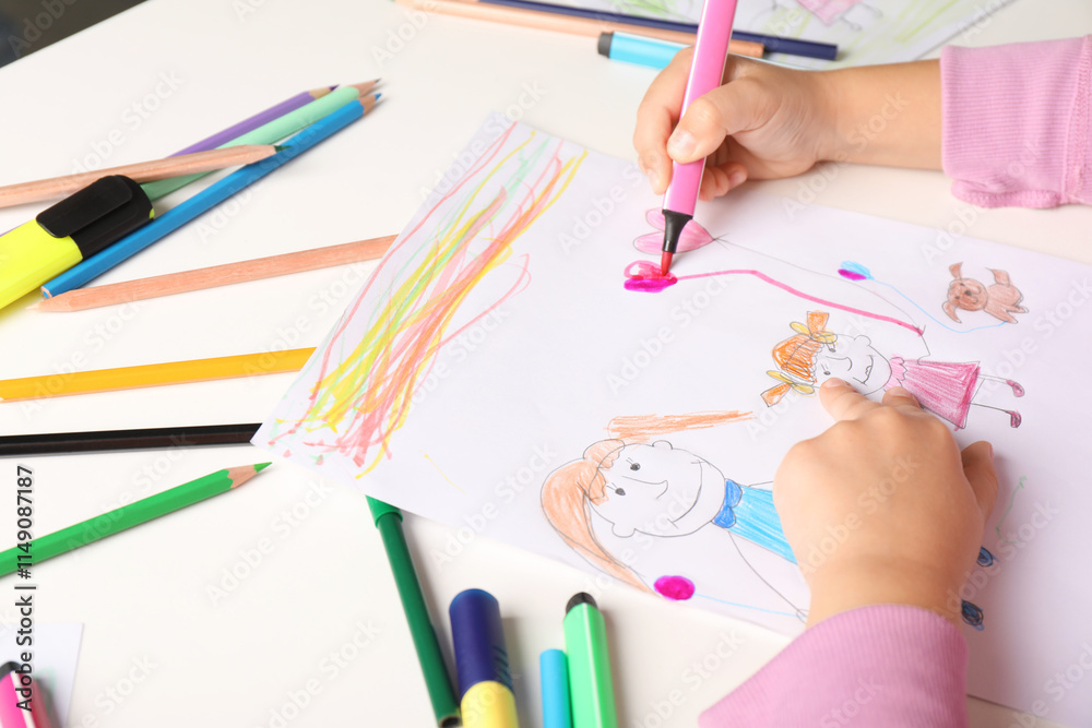 Little girl drawing his family at white table, closeup Little girl drawing his family at white table, closeup