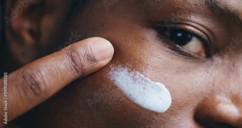 Fotografie Face, skincare lotion and black man apply moisturizer for treatment and beauty