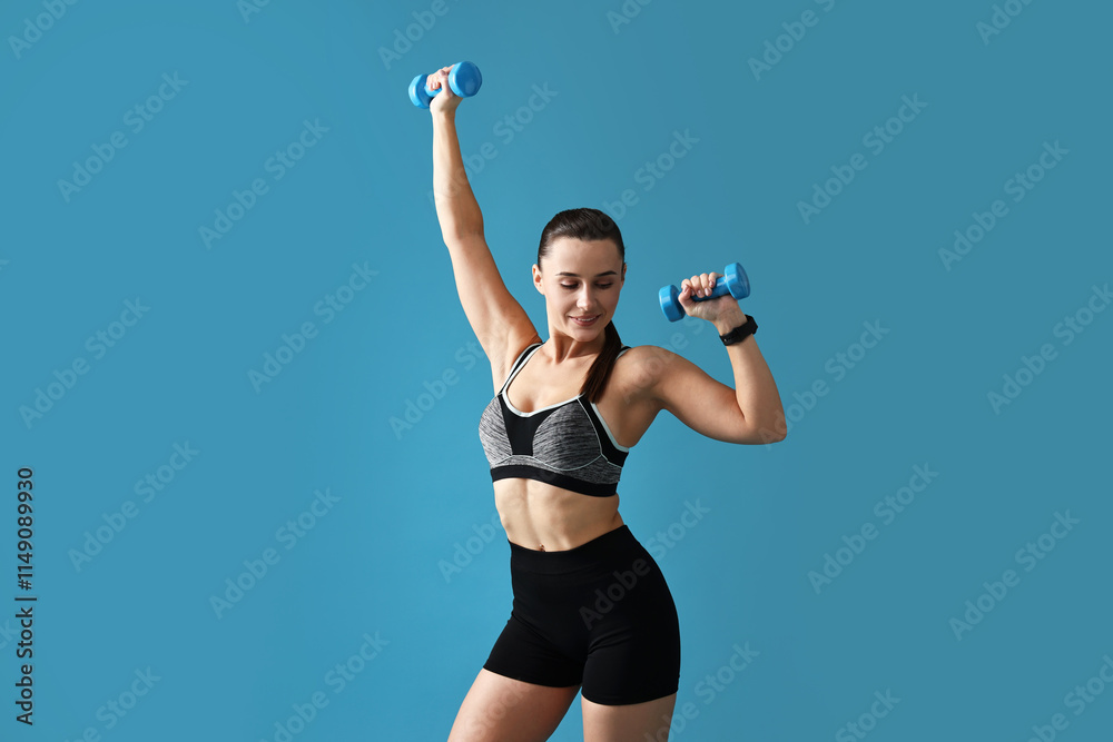 Woman in gym clothes exercising with dumbbells on light blue background Woman in gym clothes exercising with dumbbells on light blue background