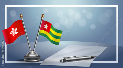 Hong Kong and Togo National flags on small table with bokeh background, cooperative relationship
