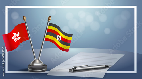 Hong Kong and Uganda National flags on small table with bokeh background, cooperative relationship
