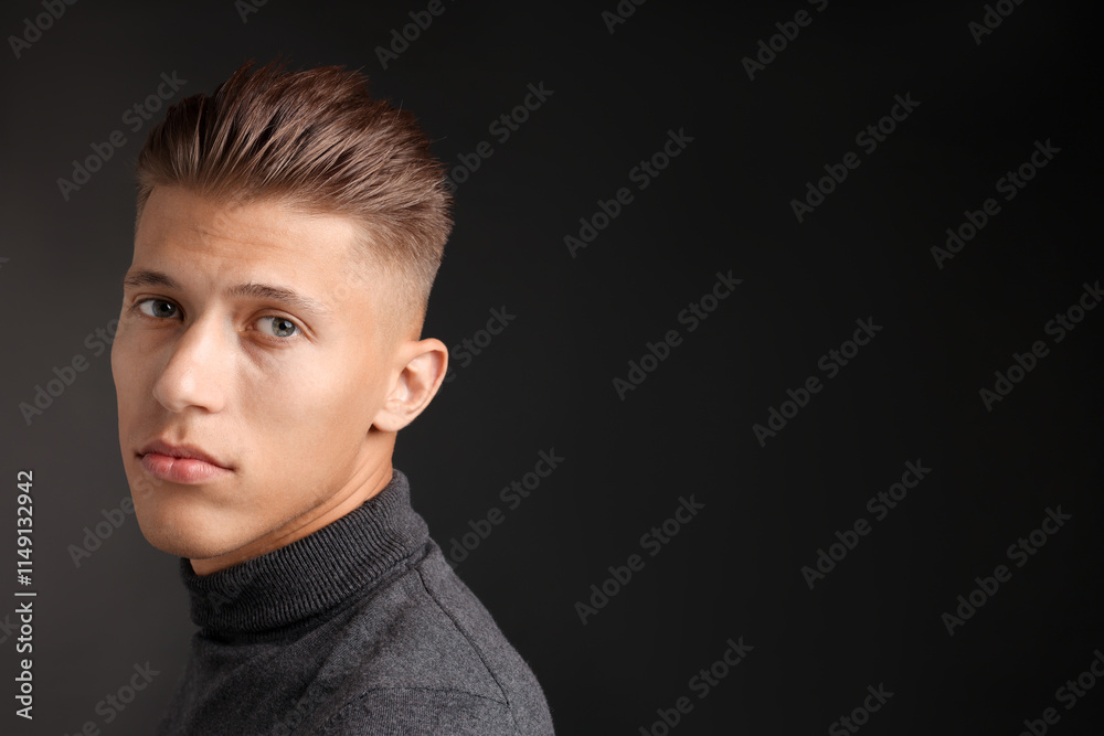 Confident young man with stylish haircut on black background. Space for text Confident young man with stylish haircut on black background. Space for text