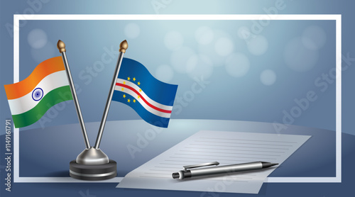 India and Cape Verde National flags on small table with bokeh background, cooperative relationship