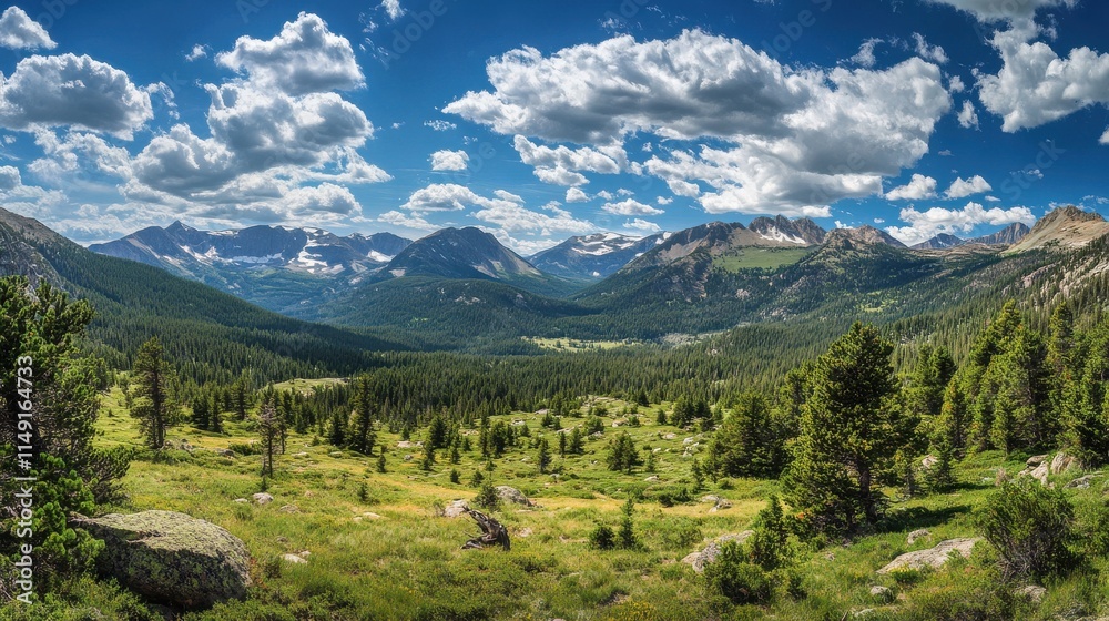 Obraz premium Breathtaking Mountain Landscape Under Blue Sky and Fluffy Clouds