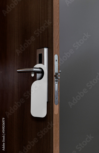 wooden door with empty tag hanging on the handle. Ideal template for mockup do not disturb sign.