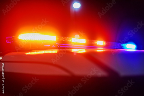 Night, police car and lights in city for emergency, public safety and procedure at crime scene. Law enforcement, vehicle and crisis in road with red, blue flashing and patrol for community protection
