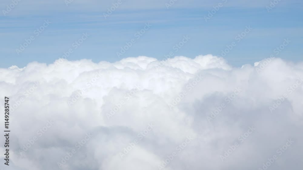 view from plane over blue sky with white Fluffy clouds while flying through in sunny summer time.nature blue sky cloud and sun for Clean Environment, save energy or transportation holiday concept. view from plane over blue sky with white Fluffy clouds while flying through in sunny summer time.nature blue sky cloud and sun for Clean Environment, save energy or transportation holiday concept.