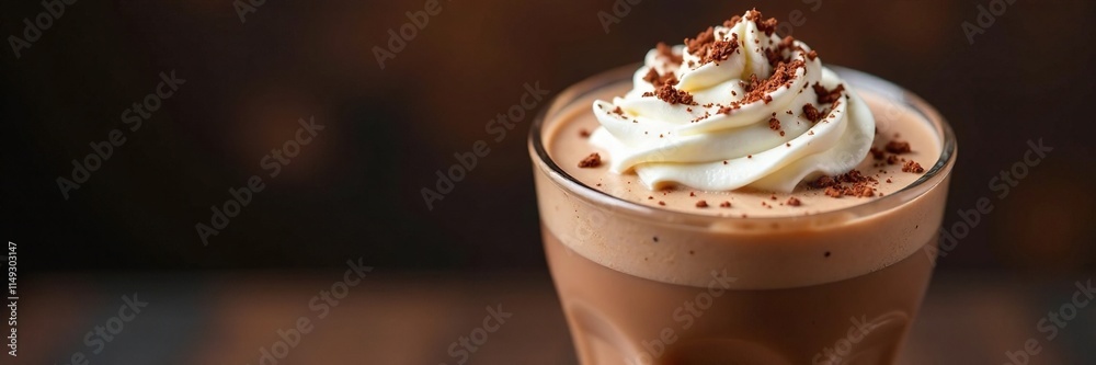 Fototapeta premium Creamy chocolate milkshake topped with a generous dollop of whipped cream and scattered with dark brown chocolate shavings, beverage, indulgent