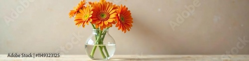 Wallpaper Mural Orange gerbera daisies in a clear glass vase with a wooden base, stem, arrangement, bloom Torontodigital.ca