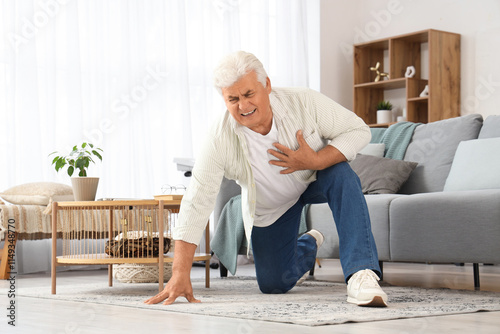 Mature man having heart att...