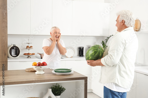 Mature man with watermelon ...