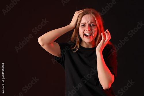 Angry young woman crying on...