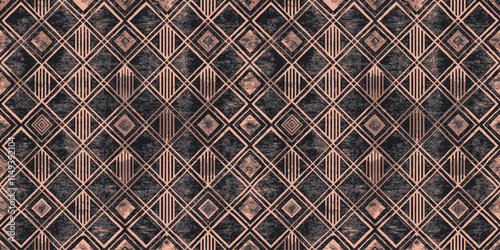 Geometric patterned fabric with contrasting diamond shapes in rose gold and deep blue hues.
