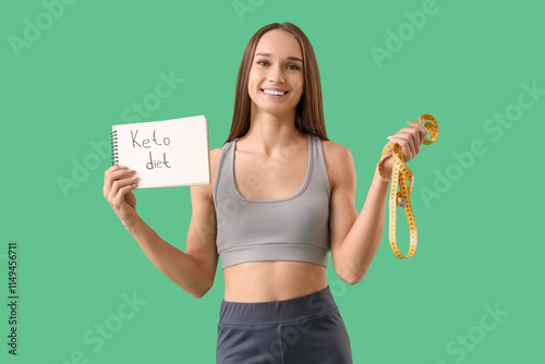 Sporty young woman holding ...
