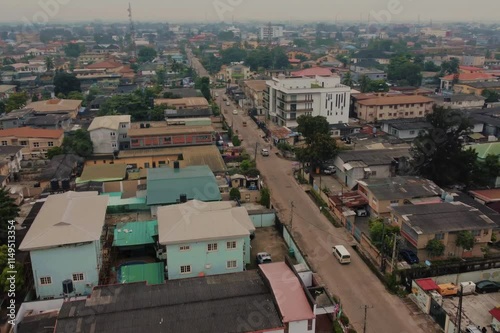 Lively Urban Streets and Rooftops in Lagos, Nigeria with a Cloudy Skyline