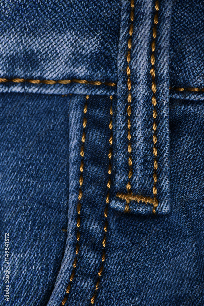 Denim fabric with yellow thread seams, denim jacket, denim pants, for background or fabric sample sale. Denim fabric with yellow thread seams, denim jacket, denim pants, for background or fabric sample sale.