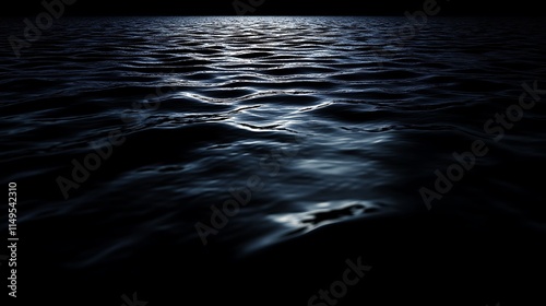 Dark blue water surface with subtle waves reflecting moonlight at night.