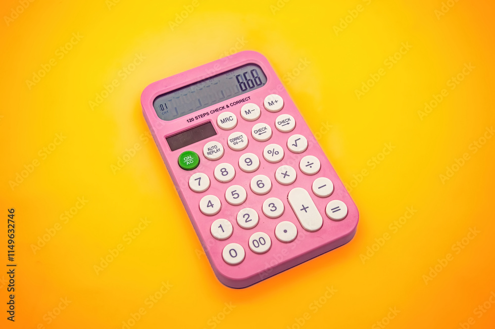 A pink calculator with white buttons on a vibrant yellow background. The display shows the number 666, making it a visually striking and colorful image A pink calculator with white buttons on a vibrant yellow background. The display shows the number 666, making it a visually striking and colorful image