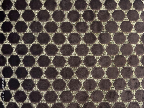 Close up of dotted hexagon pattern fabric in grey and dark purple color. Hexagonal repeated shape pattern, forming dots seamless background. photo