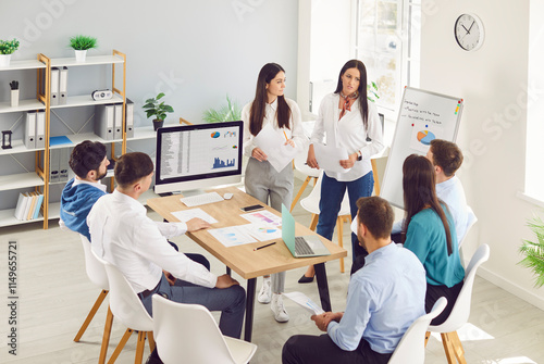 Female business coach, lady speakers in office gives presentation, speaker presenter consulting, training persuading employees client group, mentor leader explains company strategy at team meeting  photo