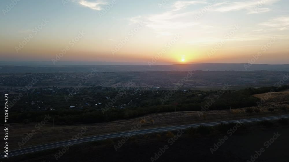 The village filmed with a drone at sunset. Landscape filmed with a drone at sunset. The village filmed with a drone at sunset. Landscape filmed with a drone at sunset.