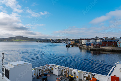 Fotografie Idyllic maritime scene of ferry departing Lerwick harbor, Shetland Islands