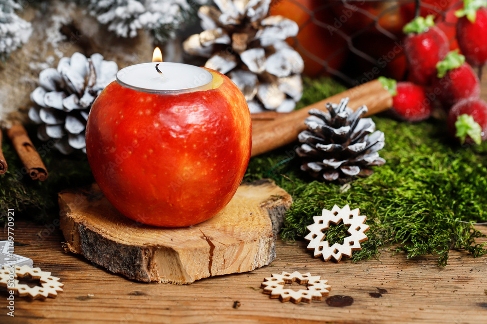 Florist at work: woman shows how to make a Christmas decoration with apple, candle and branches of fir. Step by step, tutorial.