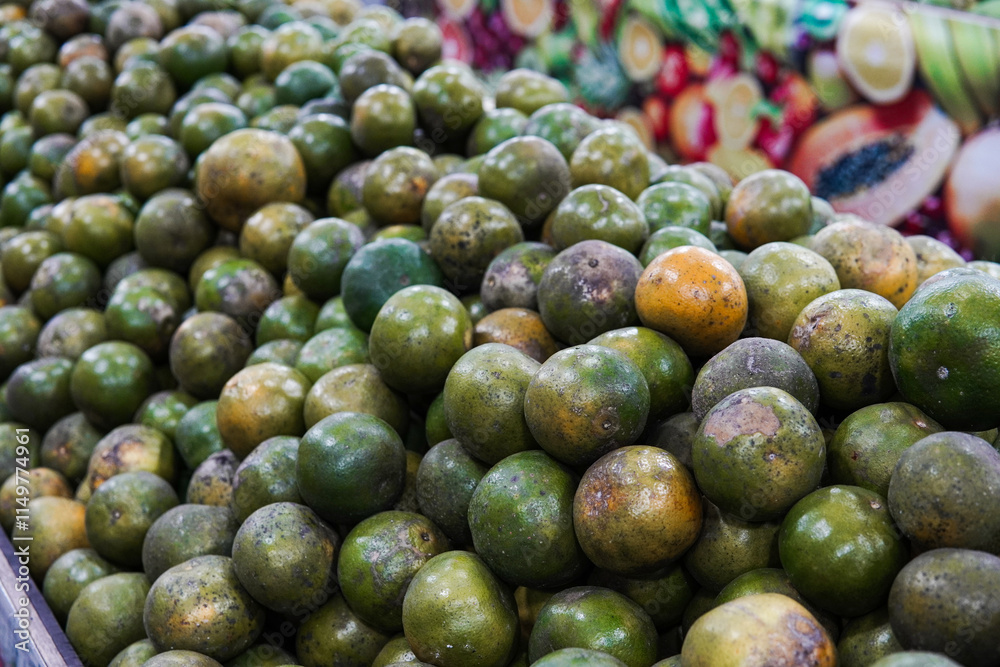Green sweet oranges in a fruit shop are suitable for use in poster designs, or as illustrations for articles about fruits. Green sweet oranges in a fruit shop are suitable for use in poster designs, or as illustrations for articles about fruits.