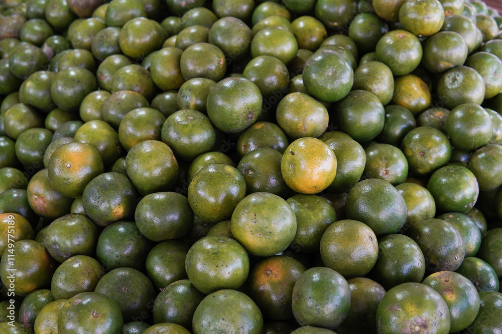 Green sweet oranges in a fruit shop are suitable for use in poster designs, or as illustrations for articles about fruits. Green sweet oranges in a fruit shop are suitable for use in poster designs, or as illustrations for articles about fruits.