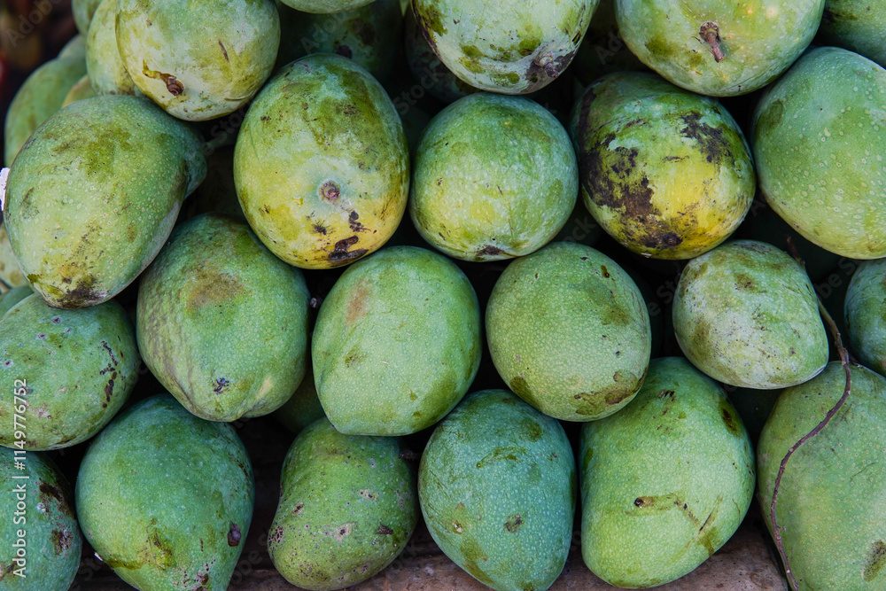 Whole fresh mangoes sold in fruit shops are suitable for design purposes, as illustrations for articles about fruits and others. Whole fresh mangoes sold in fruit shops are suitable for design purposes, as illustrations for articles about fruits and others.