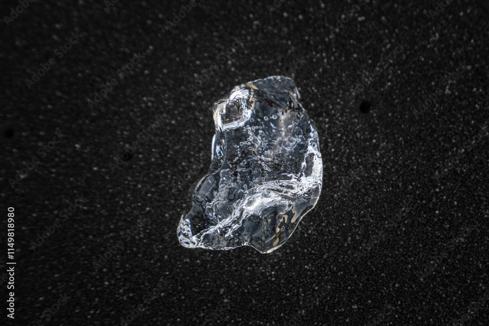 Shards of Vatnajökull Glacier ice rest on Breiðamerkursandur black sand beach, resembling scattered diamonds Shards of Vatnajökull Glacier ice rest on Breiðamerkursandur black sand beach, resembling scattered diamonds
