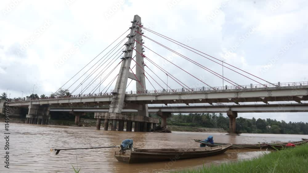 Kabel Bridge and Batanghari River at Dharmasraya West Sumatera Indonesia Kabel Bridge and Batanghari River at Dharmasraya West Sumatera Indonesia