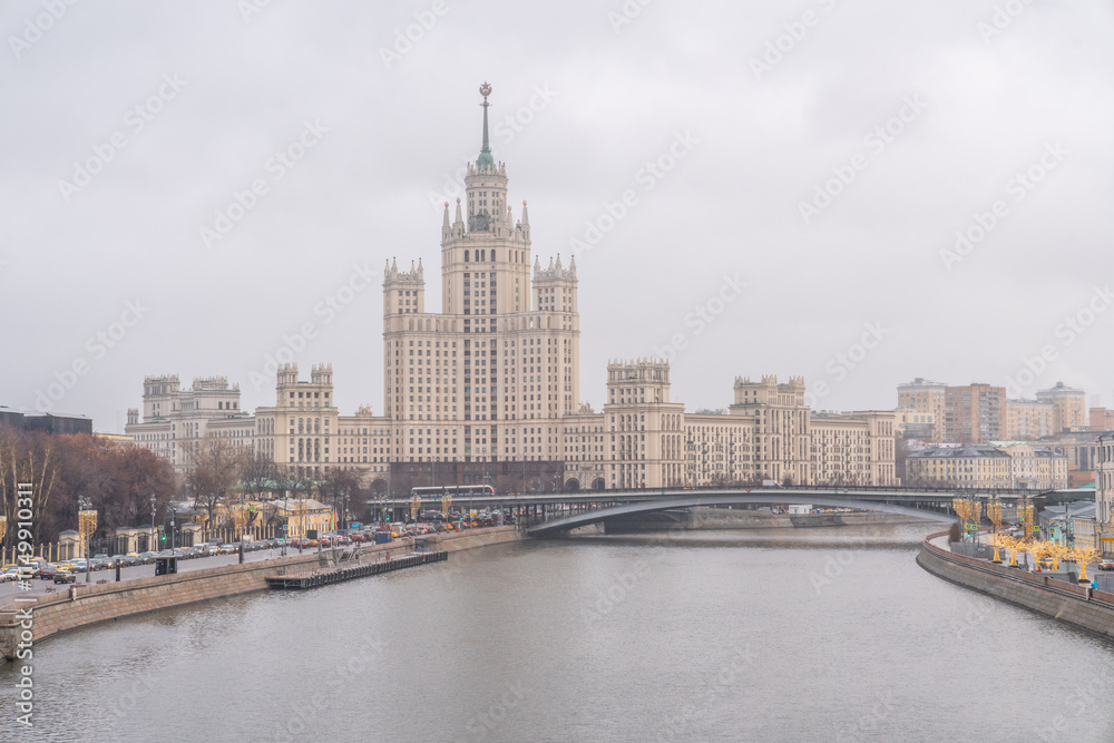 View of Moscow with the Moskva River and one of the Stalinist Seven Sisters skyscrapers on a cloudy day View of Moscow with the Moskva River and one of the Stalinist Seven Sisters skyscrapers on a cloudy day