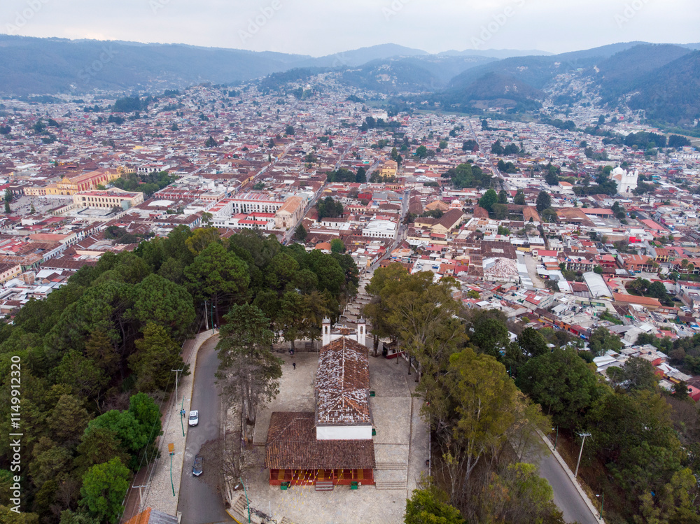 Obraz premium Aerial Drone shot of Church Iglesia de San Cristobalito on the mountain in San Cristobal de Las Casas, Chiapas, Mexico