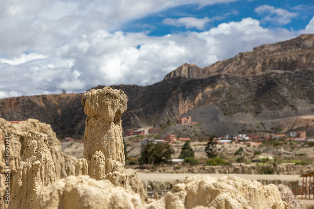 Beautiful stone mountains and valley. Rocks made of stone. Blue sky with clouds. Beautiful stone mountains and valley. Rocks made of stone. Blue sky with clouds.