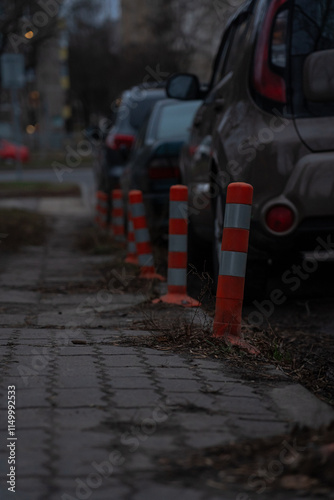 Wallpaper Mural Cars parked along sidewalks and traffic bollards in the evening in Minsk Torontodigital.ca
