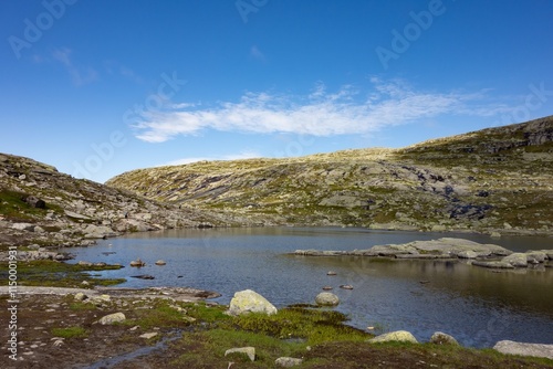 Obraz na płótnie Landscape with clear water lake on trail to Trolltunga, Norway w salonie