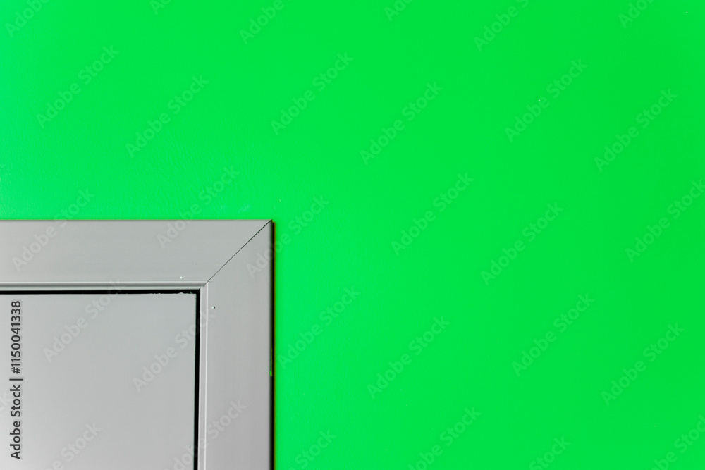An image of the corner of a doorway on a painted wall. View of the corner of the door on the tinted wall. An image of the corner of a doorway on a painted wall. View of the corner of the door on the tinted wall.